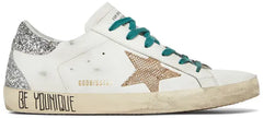 Golden Goose Wmns Superstar 'Don't Be Perfect, Be Younique' in white leather with taupe and silver details and distressed vintage finish.