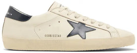 Golden Goose Superstar sneaker in beige leather with night blue suede star and distressed sole.