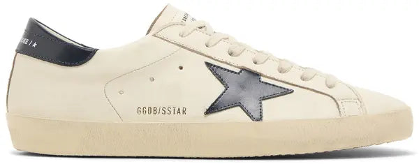 Golden Goose Superstar sneaker in beige leather with night blue suede star and distressed sole.