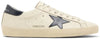Golden Goose Superstar sneaker in beige leather with night blue suede star and distressed sole.