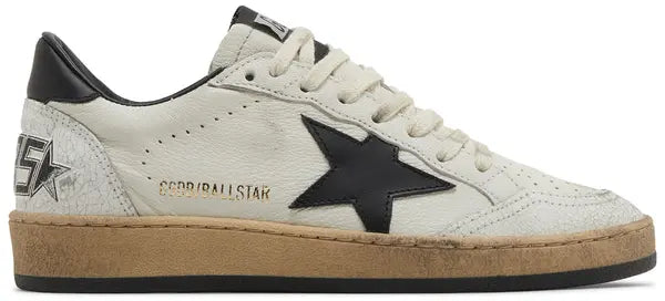 Golden Goose women's Ball Star sneaker in white leather with black star logo and heel tab, featuring a distressed rubber sole.

