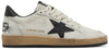 Golden Goose women's Ball Star sneaker in white leather with black star logo and heel tab, featuring a distressed rubber sole.

