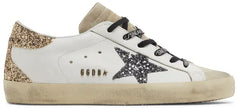 Golden Goose women's Superstar sneaker in optic white leather with seedpearl glitter star and cream suede heel tab, vintage-style distressed sole.

