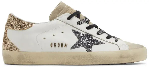 Golden Goose women's Superstar sneaker in optic white leather with seedpearl glitter star and cream suede heel tab, vintage-style distressed sole.


