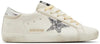 Golden Goose Women's Superstar 'White Silver Glitter' sneaker with white leather upper, glitter star patch, and pre-distressed sole.

