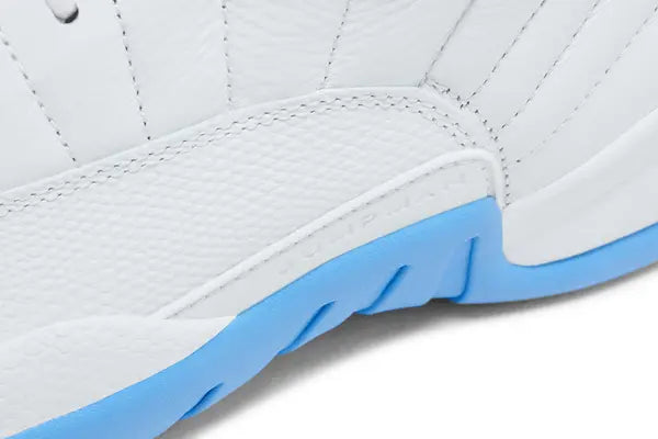 Air Jordan 12 Retro 'Melo' 2025 featuring white leather upper, University Blue accents, and Zoom Air sole with carbon fiber shank.