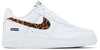 Supreme x GOODENOUGH x Nike Air Force 1 Low 'White Cheetah Print' with white leather upper, brown cheetah-print pony hair Swoosh, and translucent sole revealing co-branding.

