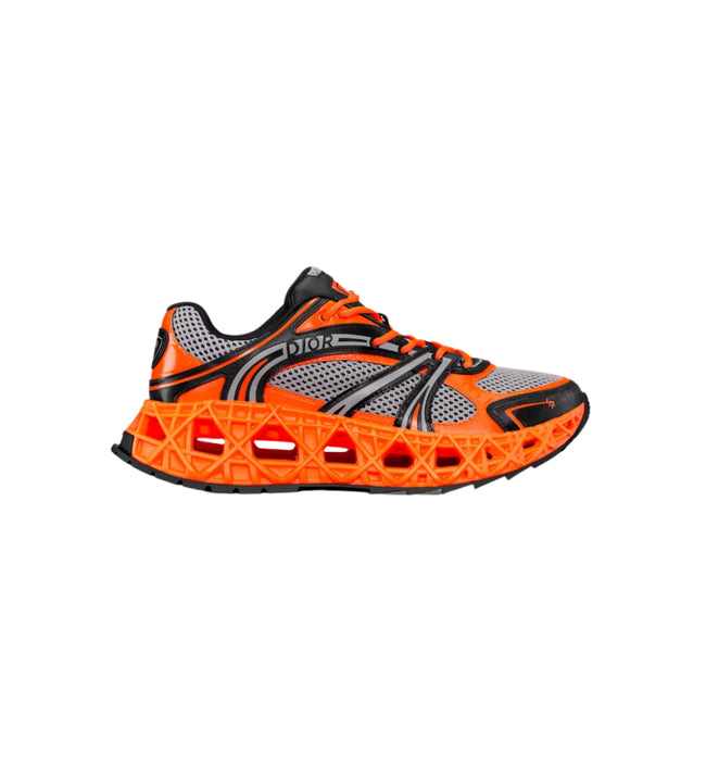 Dior B35 NXXT Sneaker in Neon Orange and Black with Cannage sole and mesh upper, limited edition of 888 pairs.

