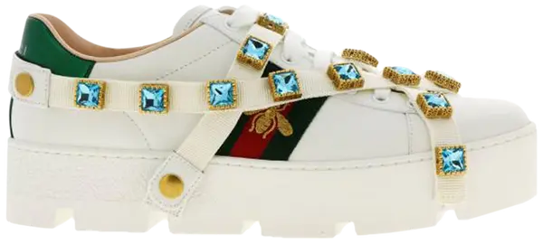 Gucci Wmns Ace Platform White Gems white leather sneaker with jeweled midsole, green and red Web stripes, and elevated platform sole.