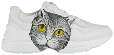 Gucci Wmns Rhyton 'Mystic Cat - White' sneaker featuring vintage cat graphic on smooth white leather with a chunky sole.


