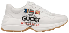 Gucci Wmns Rhyton 'Worldwide' sneaker in ivory leather with multicolor print and gum sole.

