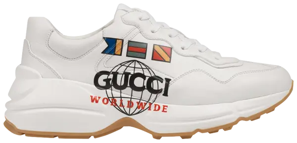 Gucci Wmns Rhyton 'Worldwide' sneaker in ivory leather with multicolor print and gum sole.

