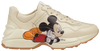 Disney x Gucci women’s Rhyton sneaker in ivory leather with Mickey Mouse print and chunky rubber sole.

