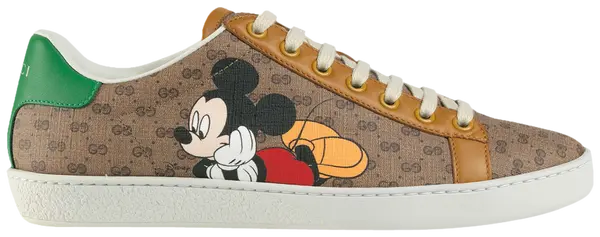 Disney x Gucci Women’s Ace sneaker in beige GG Supreme canvas with Mickey Mouse graphic and green-red Web stripe.