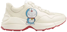 Doraemon x Gucci women’s Rhyton sneaker in ivory leather with all-over character print and chunky sole.

