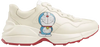 Doraemon x Gucci women’s Rhyton sneaker in ivory leather with all-over character print and chunky sole.

