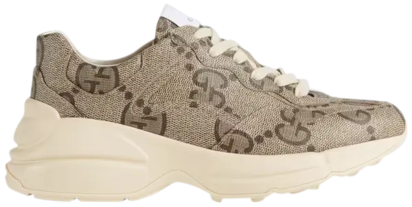 Gucci Wmns 100 Rhyton sneaker in beige and ebony GG monogram canvas with chunky rubber sole.

