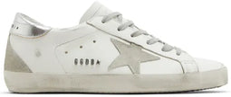 Golden Goose women's white leather sneaker with grey suede star and silver metallic heel tab, distressed outsole.