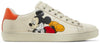 Disney x Gucci Wmns Ace Low 'Mickey Mouse - Ivory' sneaker featuring Mickey Mouse print on ivory leather with orange heel tab.