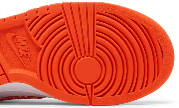 Nike Dunk Low Women’s 'Orange Paisley' sneaker with white leather upper, orange overlays, and paisley print Swoosh.