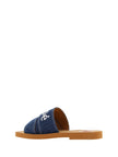 Chloé – Prächtige Woody Slide-Sandalen aus Baumwolle in Jeansblau