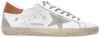 Golden Goose Superstar sneaker in white leather with light brown suede star and grey heel tab, vintage scuffed sole.