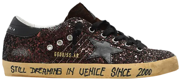 Golden Goose Superstar brown glitter sneaker with 'Still Dreaming in Venice' text and distressed sole.