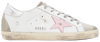 Golden Goose women’s Superstar sneaker in white leather with orchid lining, silver star, pink heel tab, and vintage-style distressing.

